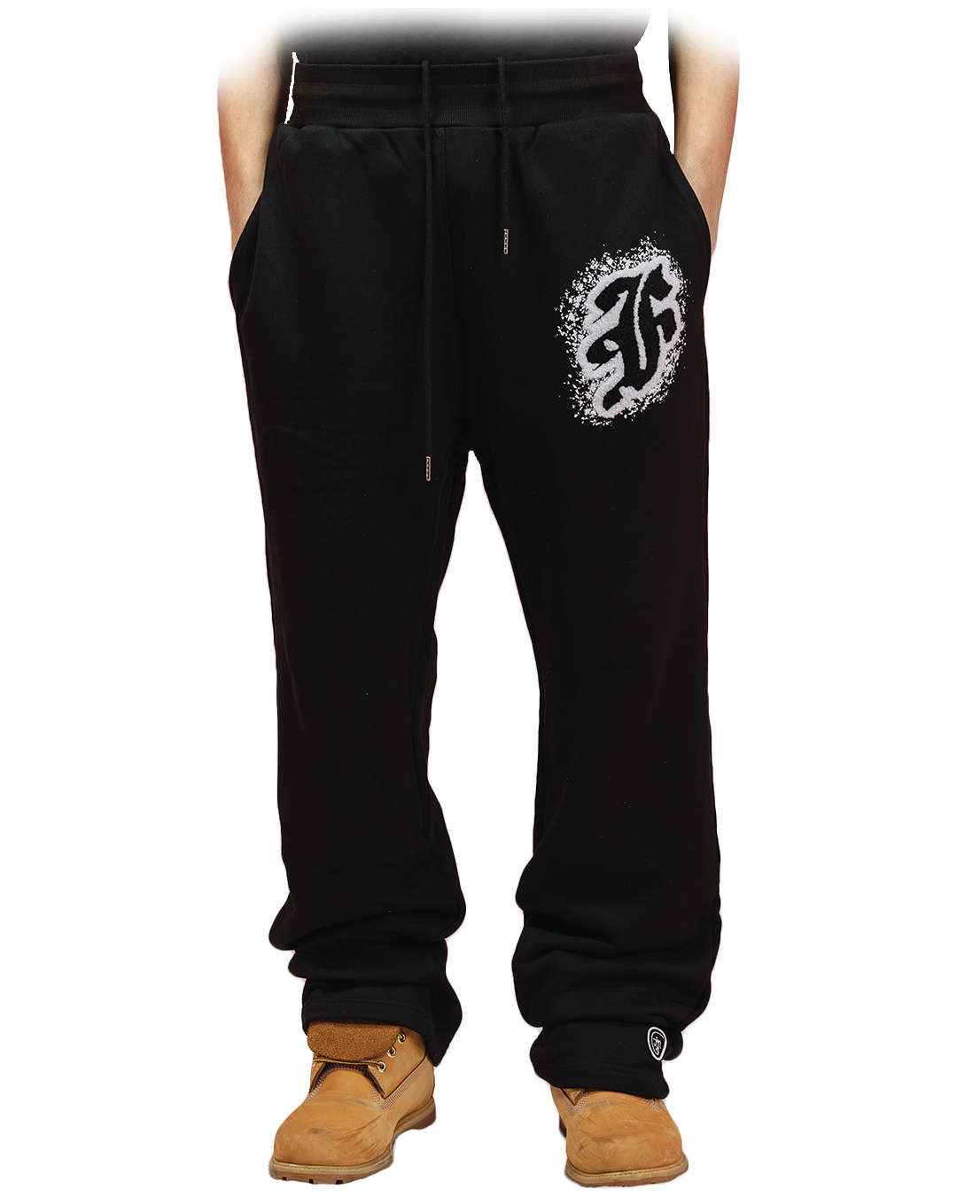 Black sweatpants with white distressed gothic “F” logo printed on the left thigh and subtle branding on the lower leg.