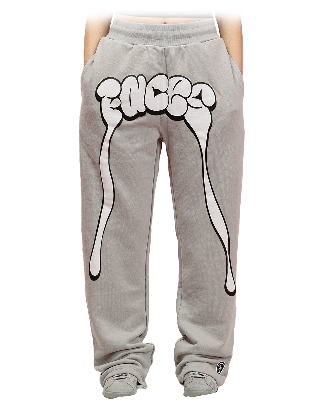 Grey sweatpants with oversized white graphic spelling “FACES” across the waist and dripping extensions down the legs.