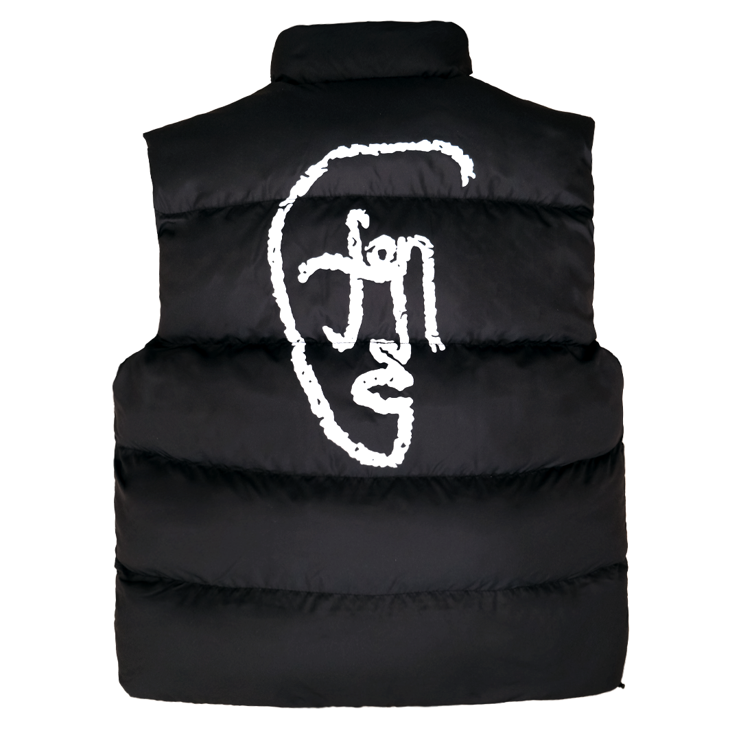 Reversible puffer vest in black with oversized white abstract FACES artwork on the back; reverse side in beige.